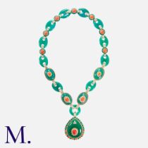 A Chrysoprase, Coral & Diamond Pendant Necklace in 14k yellow gold, comprising a series of carved