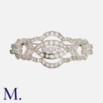 An Art Deco Diamond Brooch in 18k white gold, set with old cut diamonds and rose cut diamonds, all