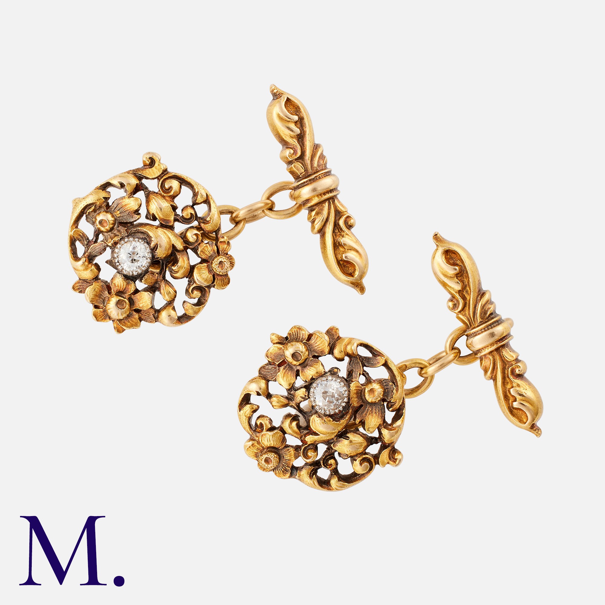 A Pair Of Art Nouveau Gold Cufflinks in 18k yellow gold, of floral, foliate design, each set with an