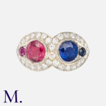 A Sapphire, Ruby (likely synthetic) & Diamond Ring, in 18k white gold, comprising two pear shaped,