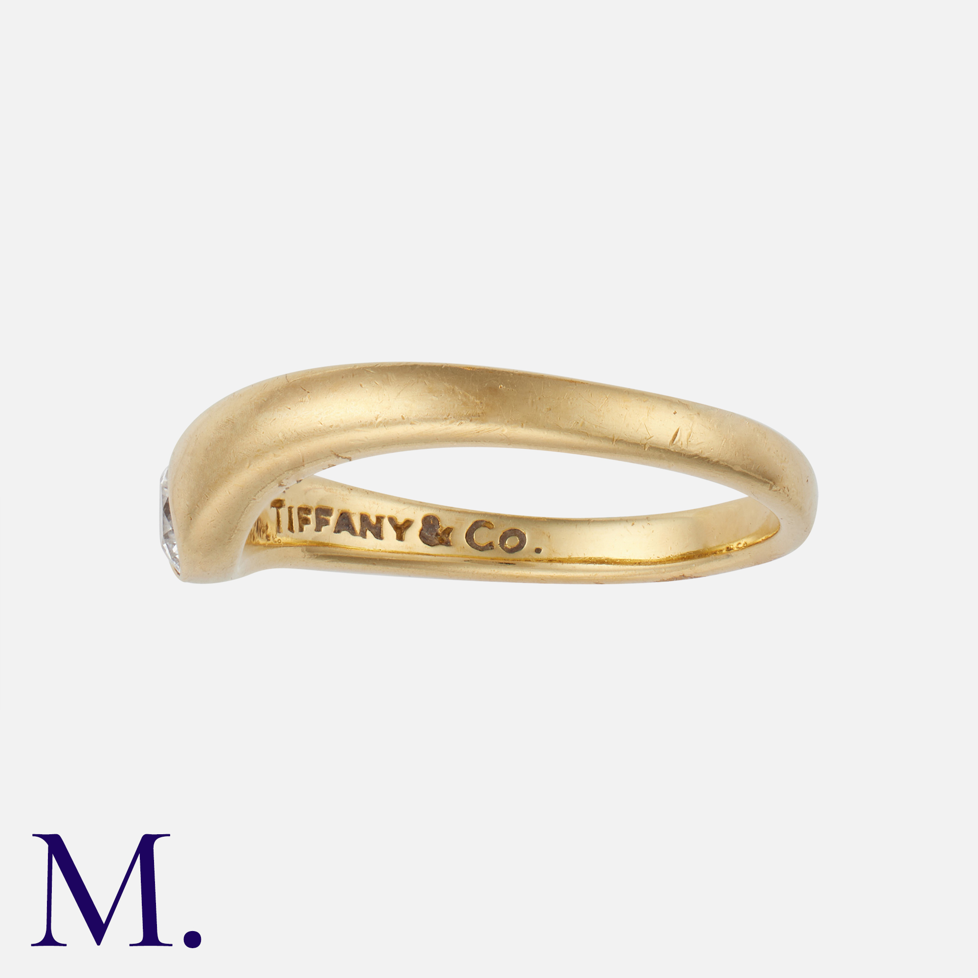 TIFFANY & CO. A Diamond Ring in 18K yellow gold, flush set with a brilliant cut diamond weighing - Image 2 of 2