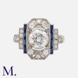 An Art Deco Sapphire & Diamond Ring in platinum, set with a principal old European cut diamond of