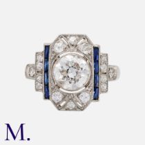 An Art Deco Sapphire & Diamond Ring in platinum, set with a principal old European cut diamond of