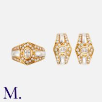 A Diamond Ring & Earring Set in 18k white and yellow gold, set with oval cut diamond and round cut