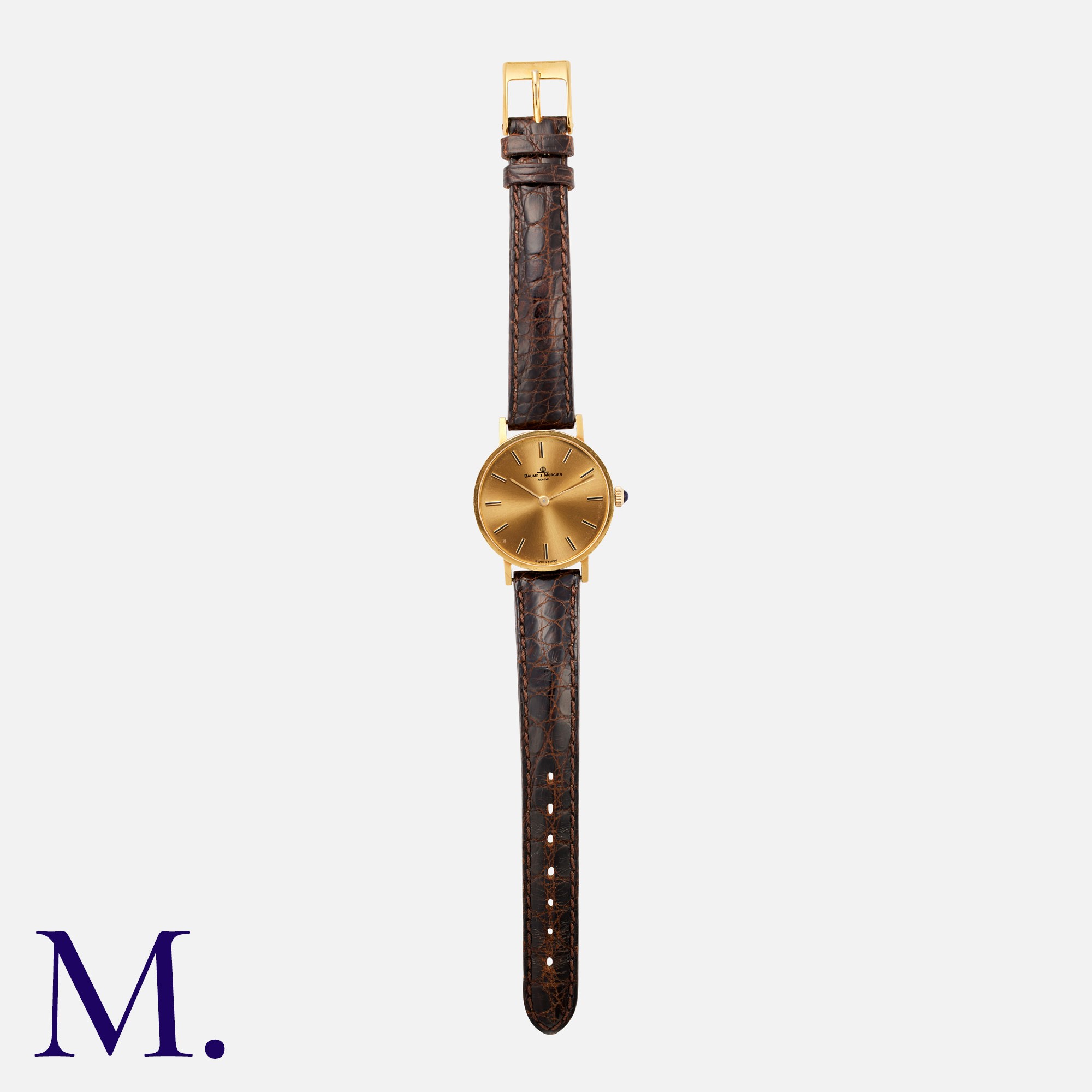 Baume & Mercier. A vintage dress watch in yellow gold, the circular champagne dial with inlaid and