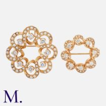 A Pair of Antique Diamond & Pearl Brooches in 14K yellow gold, each set with eight old cut