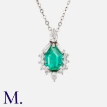 A Colombian Emerald & Diamond Pendant in 18k white gold, set with a principal mixed cut emerald