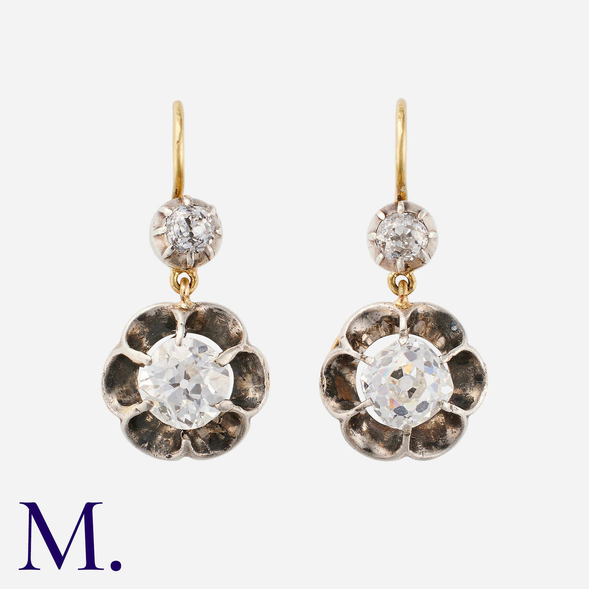 A Pair Of Antique Old Cut Diamond Earrings in 18k yellow gold and silver, each comprising a