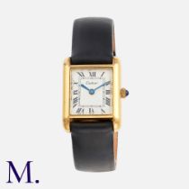 Cartier. a vintage ladies Cartier tank wristwatch in gold plate, the rectangular dial with Roman