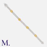 A Yellow & White Diamond Bracelet in 18k yellow and white gold, comprising two rows of round