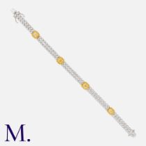A Yellow & White Diamond Bracelet in 18k yellow and white gold, comprising two rows of round