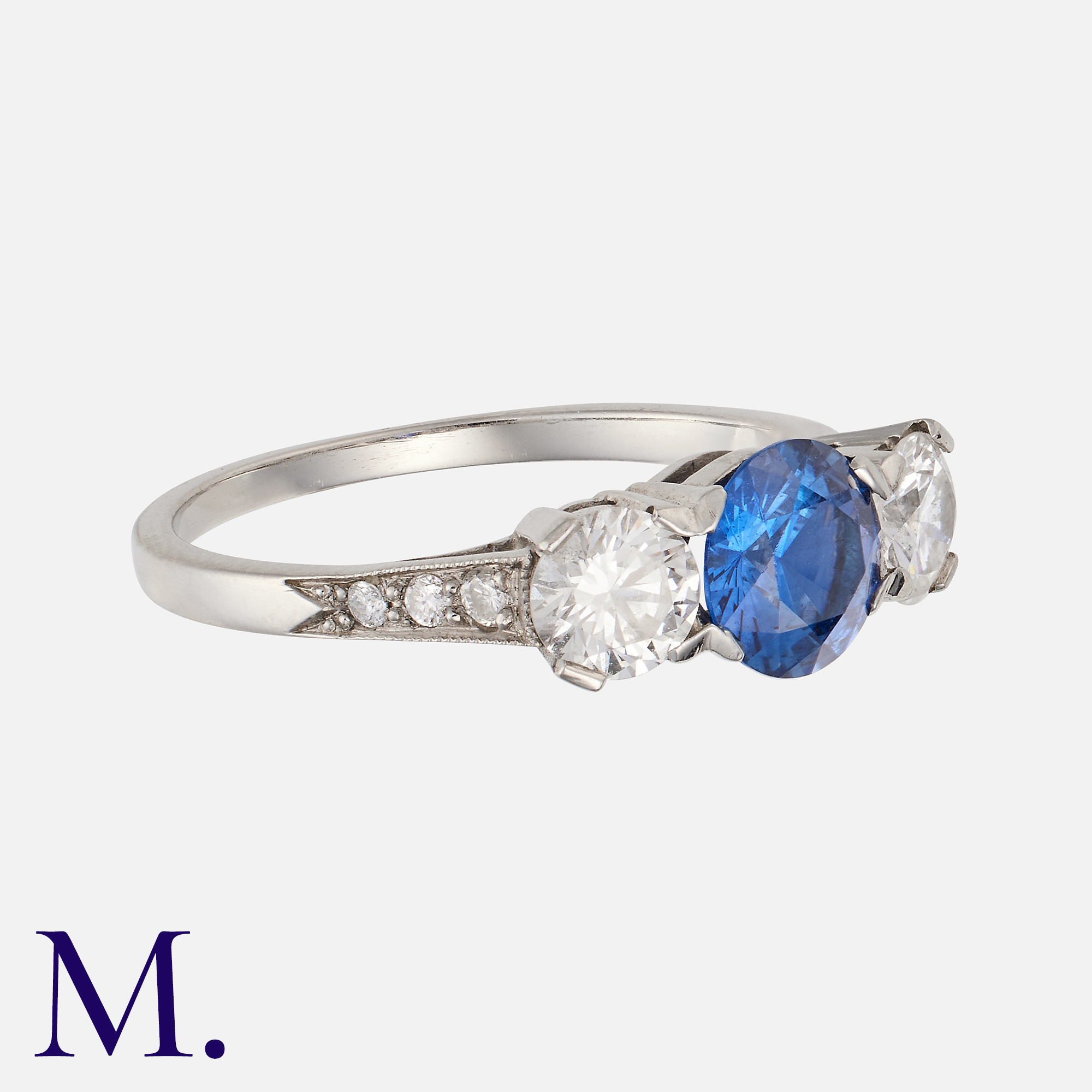 A Sapphire & Diamond Ring in platinum, the central round cut blue sapphire of approximately 0. - Image 2 of 2