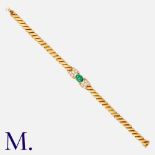 FRED. An Emerald and Diamond Bracelet in 18K yellow gold, set with a cabochon emerald with round cut