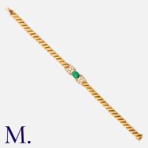 FRED. An Emerald and Diamond Bracelet in 18K yellow gold, set with a cabochon emerald with round cut