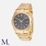Rolex. An Oyster Perpetual Wristwatch in 18ct yellow gold, 14208, the black dial with applied gilt