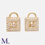 CHOPARD. A Pair Of Happy Diamond Earrings in 18k yellow gold, each comprising a 'floating' round cut