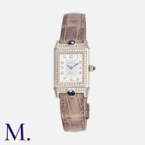Jaeger LeCoultre. A ladies sapphire and diamond reverso wristwatch in 18ct white gold, manual