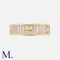 A Diamond Ring in 18K yellow gold, set with baguettes and princess cut diamonds. Size: P Weight: 7.