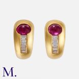 A Pair of Ruby & Diamond Earrings in 18K yellow gold, set with a cabochon ruby and baguette cut