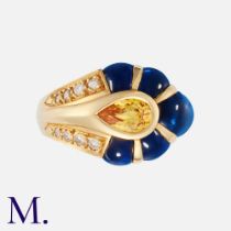 A Sapphire & Diamond Ring in 18k yellow gold, set with a pear shaped yellow sapphire of