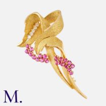 BEN ROSENFELD, A 1960's Modernist Ruby And Diamond Brooch, in yellow gold, of textured, abstract