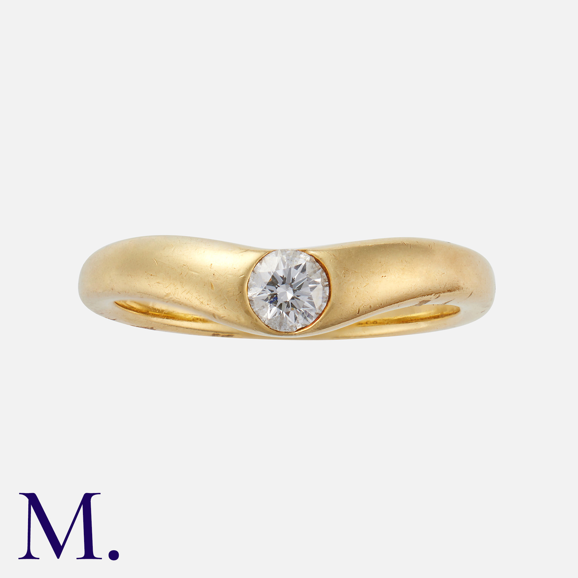 TIFFANY & CO. A Diamond Ring in 18K yellow gold, flush set with a brilliant cut diamond weighing