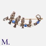 An Antique Diamond, Sapphire and Pearl Brooch in gold and silver, taking the form of four birds