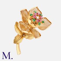 A Fine Ruby, Diamond & Emerald Articulated Flower Brooch, set with a brilliant cut diamond to the