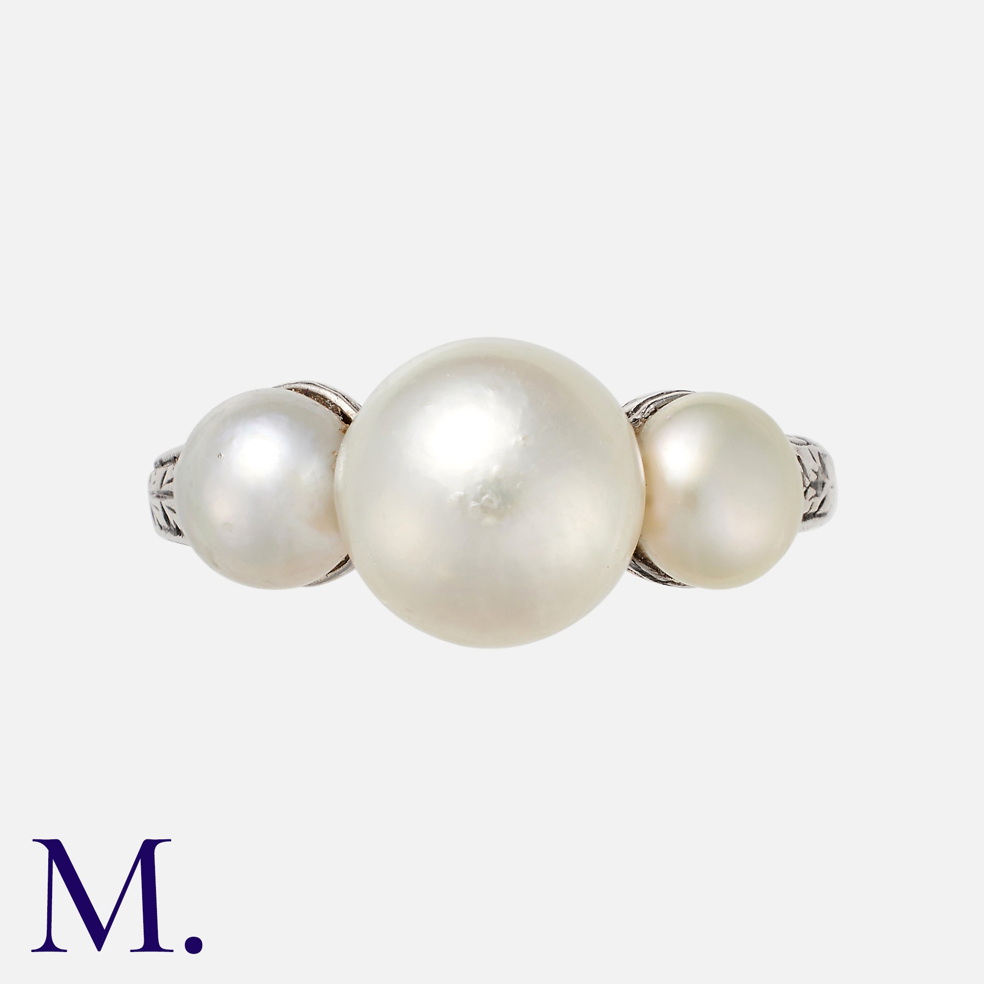 A Natural Pearl Three Stone Ring in platinum set with three pearls to an engraved band. With a