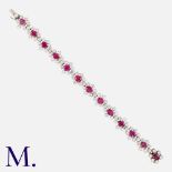 A Burma No Heat Ruby & Diamond Bracelet in 18k white gold, comprising a row of thirteen ruby and dia