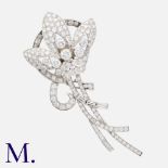 A 1940's Diamond Floral Spray Brooch in platinum, set with round and baguette cut diamonds totalling
