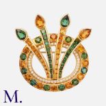 A Diamond, Tourmaline and Citrine Brooch in 18K yellow gold, set with round, princess and pear-cut
