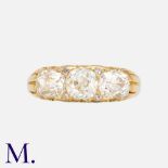 An Old Cut Diamond Three Stone Ring in yellow gold, set with three principal old cut diamonds