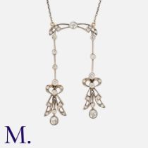 A Diamond Negligee Pendant Necklace in yellow gold and silver, comprising two old cut diamond set