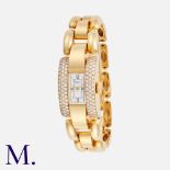 CHOPARD. A Ladies Diamond bracelet watch in 18ct yellow gold, the rectangular white dial with