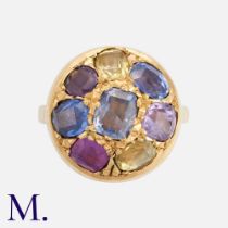 A Multi-Coloured Sapphire Ring, in high carat yellow gold, set with eight mixed cut sapphires, the