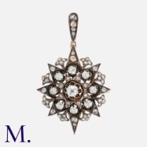 An Antique Diamond Star Brooch Pendant in silver and gold, set with rose cut and old cut diamonds