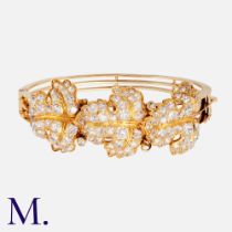 An Antique Diamond Bangle in yellow gold, comprising three large leaf motifs set with old cut