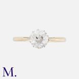 A Diamond Solitaire Ring in 18k yellow gold and platinum, set with a principal transitional cut