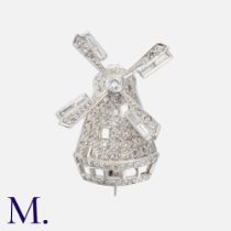 A Diamond Windmill Brooch in platinum, designed as a windmill with articulated spinning blades,