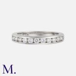 TIFFANY & CO. A Diamond Half Eternity Ring in Platinum, set with eleven brilliant cut diamonds