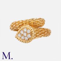 BOUCHERON. A Diamond Serpent Bohème Ring in 18K yellow gold, set with 8 round cut diamonds