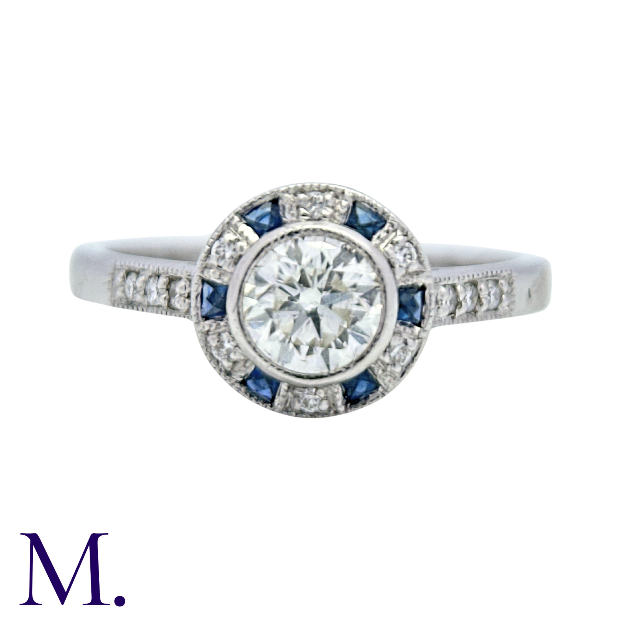 A Diamond And Sapphire Target Cluster Ring in 18k white gold, set with a principal round cut diamond