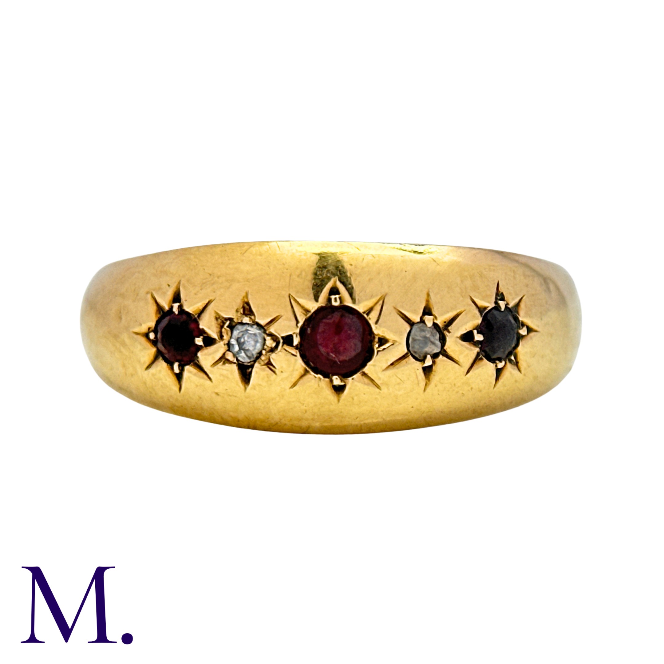 A Red Stone And Diamond Five Stone Gypsy Ring in 18k yellow gold, set with three red stones,