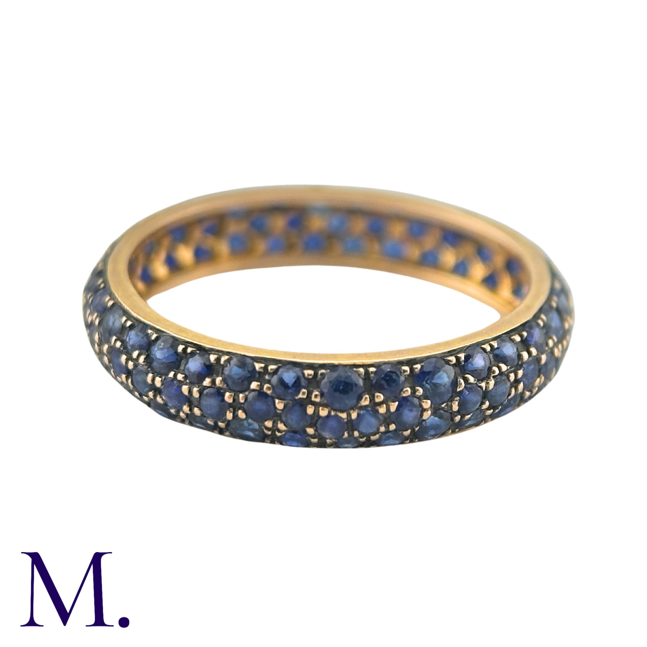 A Sapphire Eternity Ring in 18K yellow gold, set with three rows of round cut sapphires. Size: N - Image 2 of 2