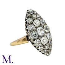 An Old Cut Diamond Navette Ring in yellow gold and silver, the navette shaped face set with old