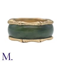 A Nephrite and Gold Ring in 14K yellow gold. The continuous nephrite band encircles the band with