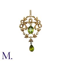 A Peridot And Pearl Pendant in yellow gold, the open work foliate and scrolling form set with an