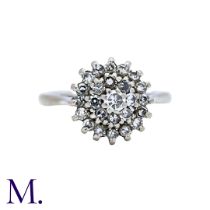 A Diamond Cluster Ring in 18k white gold, set with a cluster of round cut diamonds. Stamped 18ct.