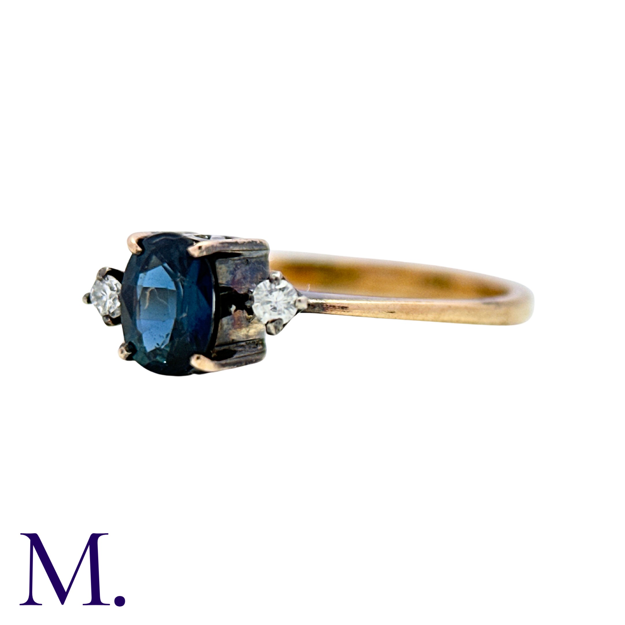 A Sapphire And Diamond Ring in 14k yellow gold, set with an oval cut sapphire between two round - Image 2 of 3